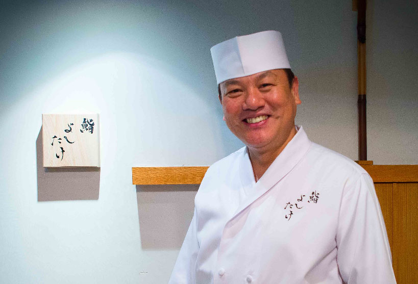 Masahiro Yoshitake (6 Michelin stars) smiling and posing